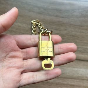 Louis Vuitton #306 Lock and Key Gold Brass with new unbranded chain